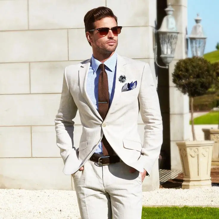 Linen suit, pale blue shirt, brown knitted tie. bit.ly/1OggnTH | Blue shirt  men, Blue linen suit, Beige suits